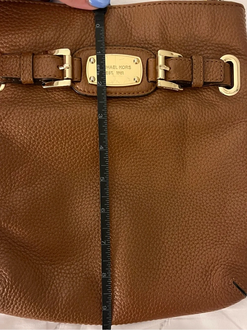Michael Kors features 	•	genuine